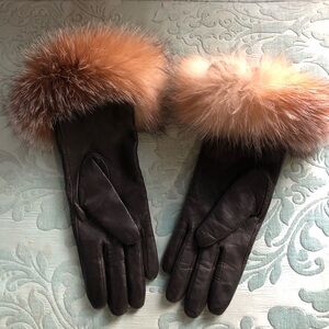 Elegant black leather gloves , trimmed brown fur around wrists.